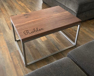 Custom engraved walnut coffee table. Mounted to carbon steel legs.