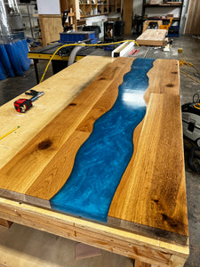 Epoxy river table, mounted to carbon steel legs